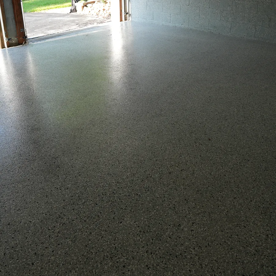 After: glossy sealed flake floor, easy to rinse clean